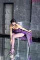 A woman sitting on top of a clear chair.