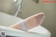 A woman's foot with a bandage wrapped around it.