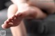 A close up of a person's feet on a couch.